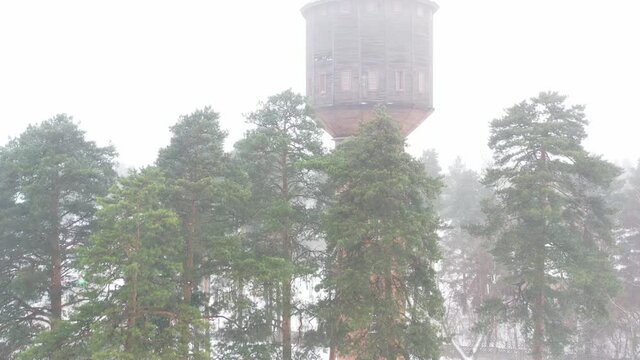 view of the old water tower standing by the road