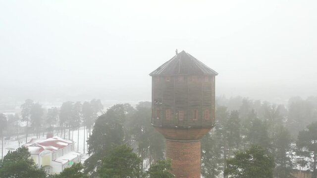view of the old water tower standing by the road