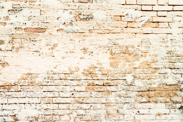 Texture of a brick wall with cracks and scratches which can be used as a background