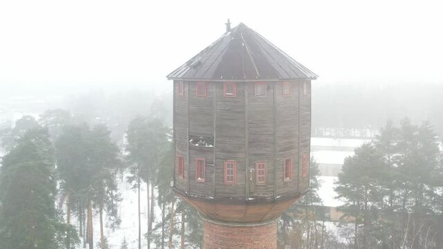 view of the old water tower standing by the road