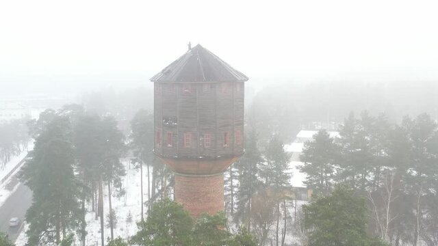 view of the old water tower standing by the road