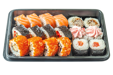 assorted japanese rolls in a black plastic box isolated on white
