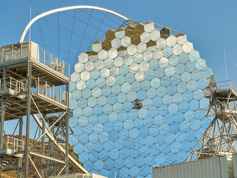 MAGIC telescope with mirror segments against cloudless blue sky in daylight at astronomical observatory site on island of La Palma in Spain