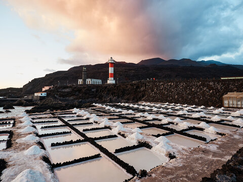 Amazing scenery of salt flats located near sea at sunset in La Palma in Spain
