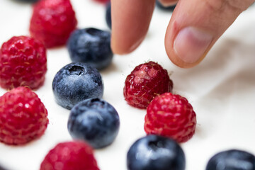 Cheese cake strawberry and raspberry on creamy white flat layer. Cooking at home. Recipe and cooking activity with pastry and bakery. Cheesecake with fruits
