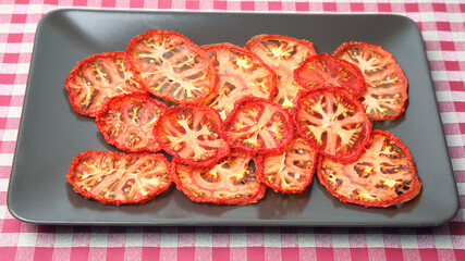 dried tomato slices on a plate. Vitamin vegetable food