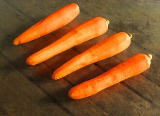 Photo of four peeled carrots ready to be cooked