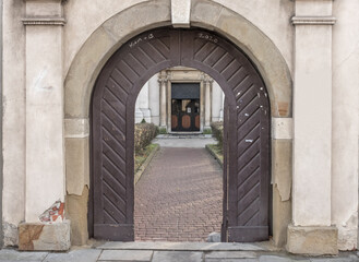 Fototapeta na wymiar Poland Krakow Catholic Church arch, open gate