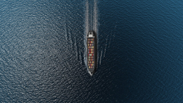 Cargo ship with containers in the open blue sea- Top down view 
, Freight Shipping export and import concept, container ship carries cargo across the ocean. Transportation. Delivery. Logistics.
