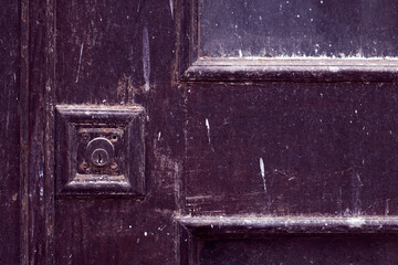 the old door with lock and repairs resting - close up, closed door and place for announcement