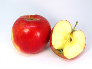 Delicious whole apple and half an apple.  