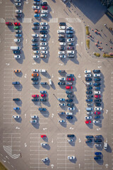 Rows on the cars on a large parking lot near the supermarket - the end of the quarantine concept....