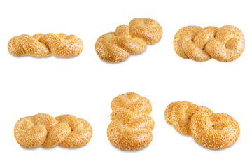 Wheat white braided bread with sesame seeds on a white isolated background