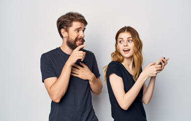 young couple with phone in hands dissatisfaction with technology