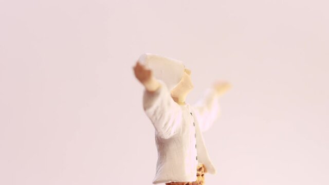 Rotating figure of dancing dervish - timelapse footage