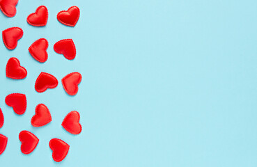 Hearts on a blue background, Valentine's Day banner, horizontal orientation, copy space