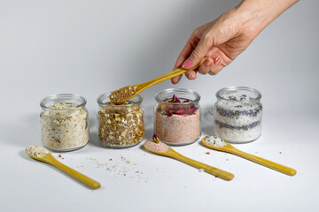 hand holding a jar of  salt