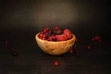 assorted wild red berries in a Cup