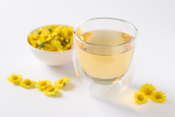 Organic Chrysanthemum flower tea in a cup on white background, Healthy Herbal drink