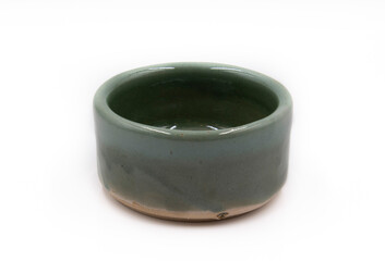 Green ceramic bowl white background