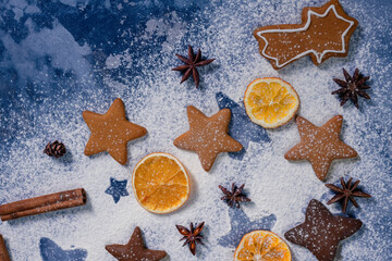 Collection of various gingerbread christmas cookies with dried orange slices