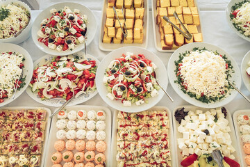 Catering food table set decoration. Table with all kinds of delicious food at party.