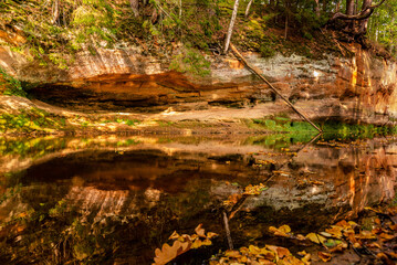 surrounded by forest on the steep bank of the river