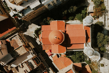 Aerial drone top down view of Orthodox Church Dormition of Theotokou Virgin Chrisopileotissis,Athens,Greece.