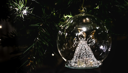 Crystal transparent bauble on christmas tree.
