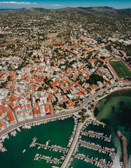 Aerial View of Port Aegina With Luxury Yachts and sailing boats parking on shore.Cityscape wide view over Aegina Island.