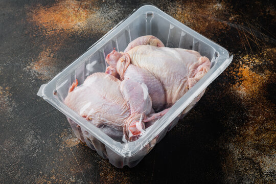 Raw Chicken In Plastic Vacuum Tray, On Old Rustic Background