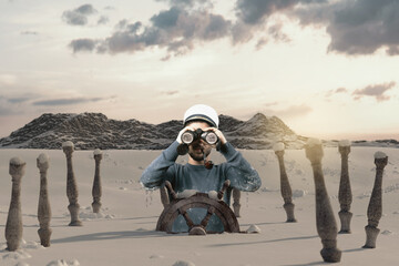 shipwrecked helmsman watching with binoculars the mountain and stuck in snow - obrazy, fototapety, plakaty
