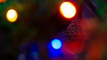 Decoration at christmas tree with blurred RGB lights