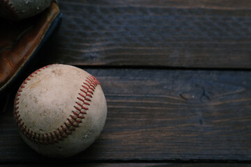 Baseball on wood background for sport copy.