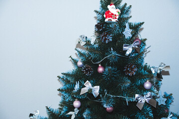 Christmas toys on a green Christmas tree close-up. New year concept