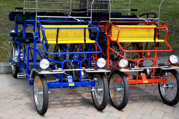 Fototapeta na wymiar Four wheel sightseeing tourist carts. Svenskarnas Dag Swedish Heritage Day Minnehaha Park Minneapolis Minnesota USA