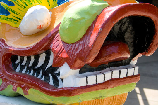 Snout of dragon from racing boat at staging area. Dragon Festival Lake Phalen Park St Paul Minnesota USA