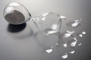 broken hourglass. waste of time. end of opportunity. stop measuring hours. shards of glass....