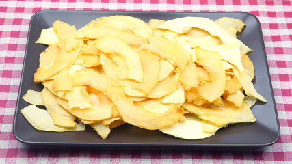 dried pieces of fragrant melon on a plate. vitamin fruit food