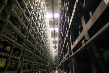 Shizuoka,Japan-Ocotber 6, 2018: Neatly stacked whisky barrels or casks in a giant cellar
