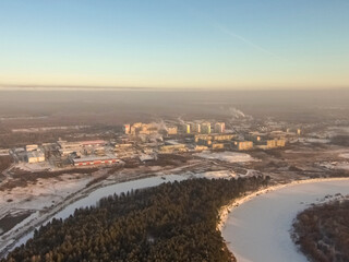 small provincial town nestled in the woods by the river on a frosty winter morning