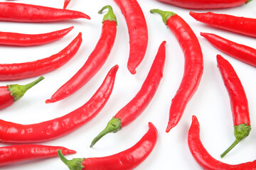 Red hot chili peppers on a white background. Vitamin vegetable food