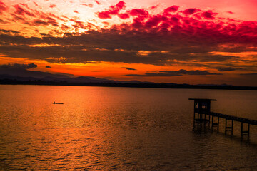 Fototapeta premium The background of the morning light, the wallpaper of the Twilight sky, the lake or the sea, is a natural beauty, seen between travel.