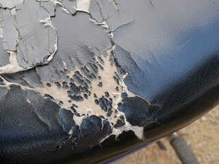 old motorcycle leather seat damage and torn.
