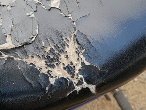 Old Motorcycle Leather Seat Damage And Torn.
