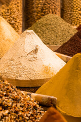 A variety of spices such as curry, turmeric, pepper, saffron, sesame and many more at the Grand Bazaar in Istanbul. Gastronomic tourism in Turkey.