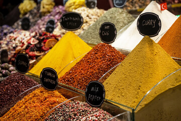 A variety of spices such as curry, turmeric, pepper, saffron, sesame and many more at the Grand Bazaar in Istanbul. Gastronomic tourism in Turkey.