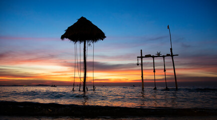 Old Traiditional and classice Swing in the sea, romantic relaxation place