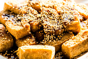 Fried tofu with sesame in plate , in door Chiangmai Thailand