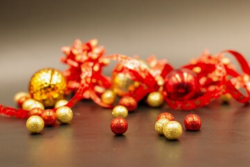 Golden gifts for Chinese Holiday with red ribbon on dark background